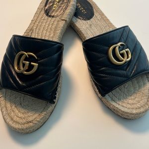 Authentic Marmont Nappa Charlotte espadrille GG logo in gold on each shoe.